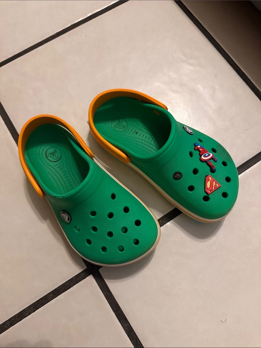CROCS Kids Green Clogs with Orange Heel Strap and Superhero Jibbitz